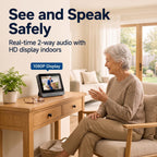 Senior woman sitting indoors using the two-way audio feature on her Large Screen Video Doorbell for Seniors HD monitor