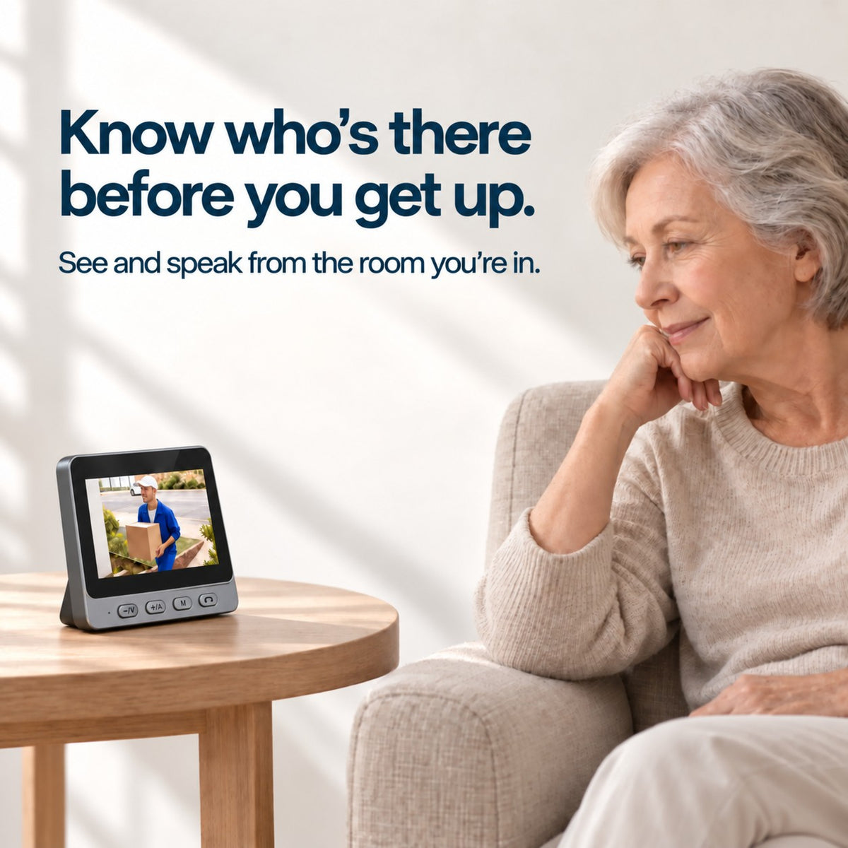 Older woman viewing a doorstep visitor on an EaseLiving indoor video doorbell monitor without using a smartphone