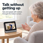 Older adult speaking with a doorstep visitor through the EaseLiving indoor video doorbell monitor